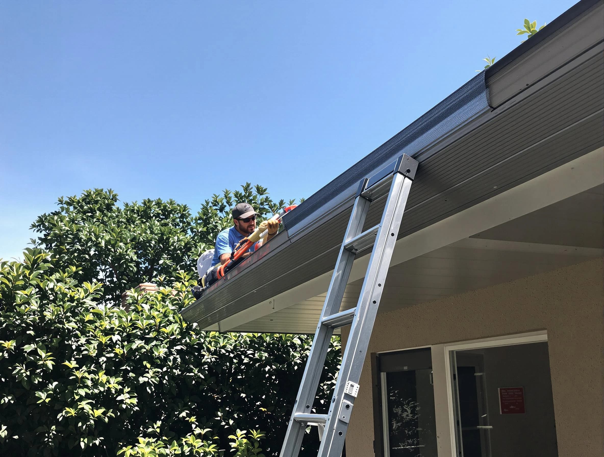 Bedford Roofing Company installing gutter guards for a homeowner in Bedford, OH